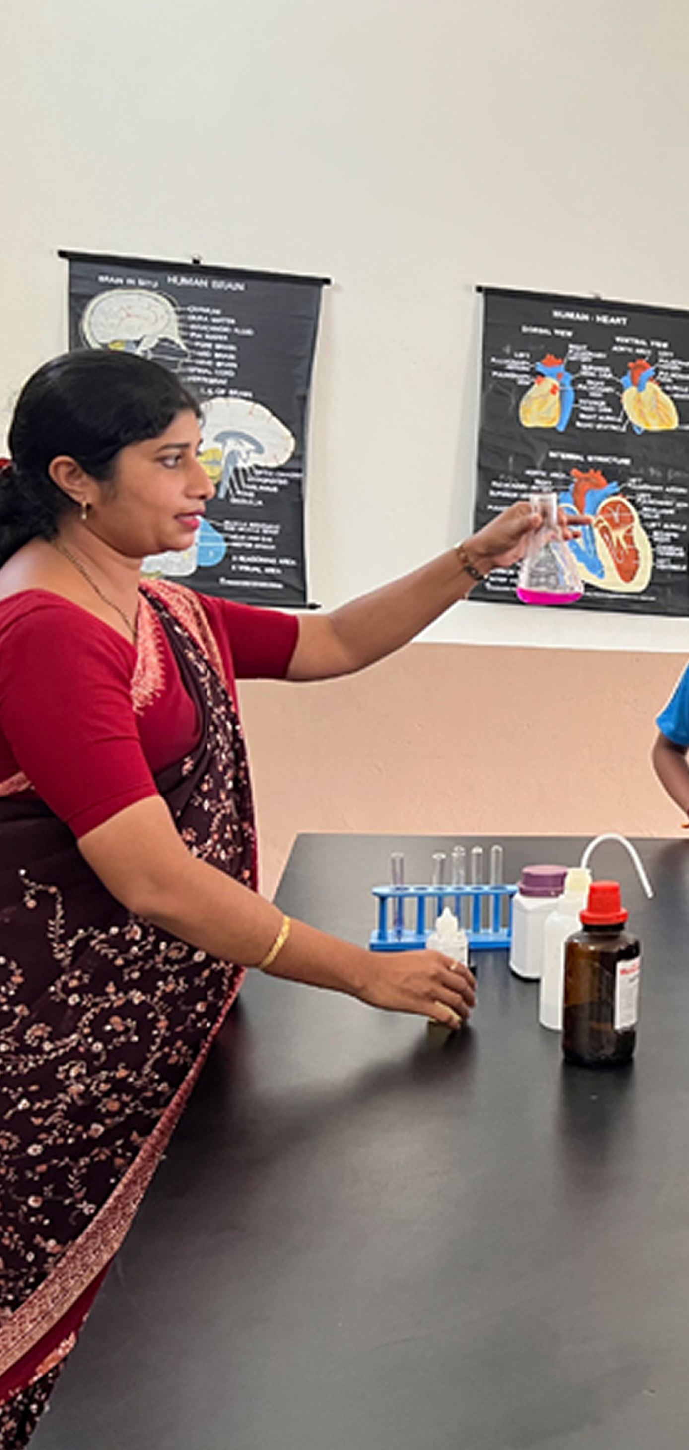Teacher with chemistry equipment