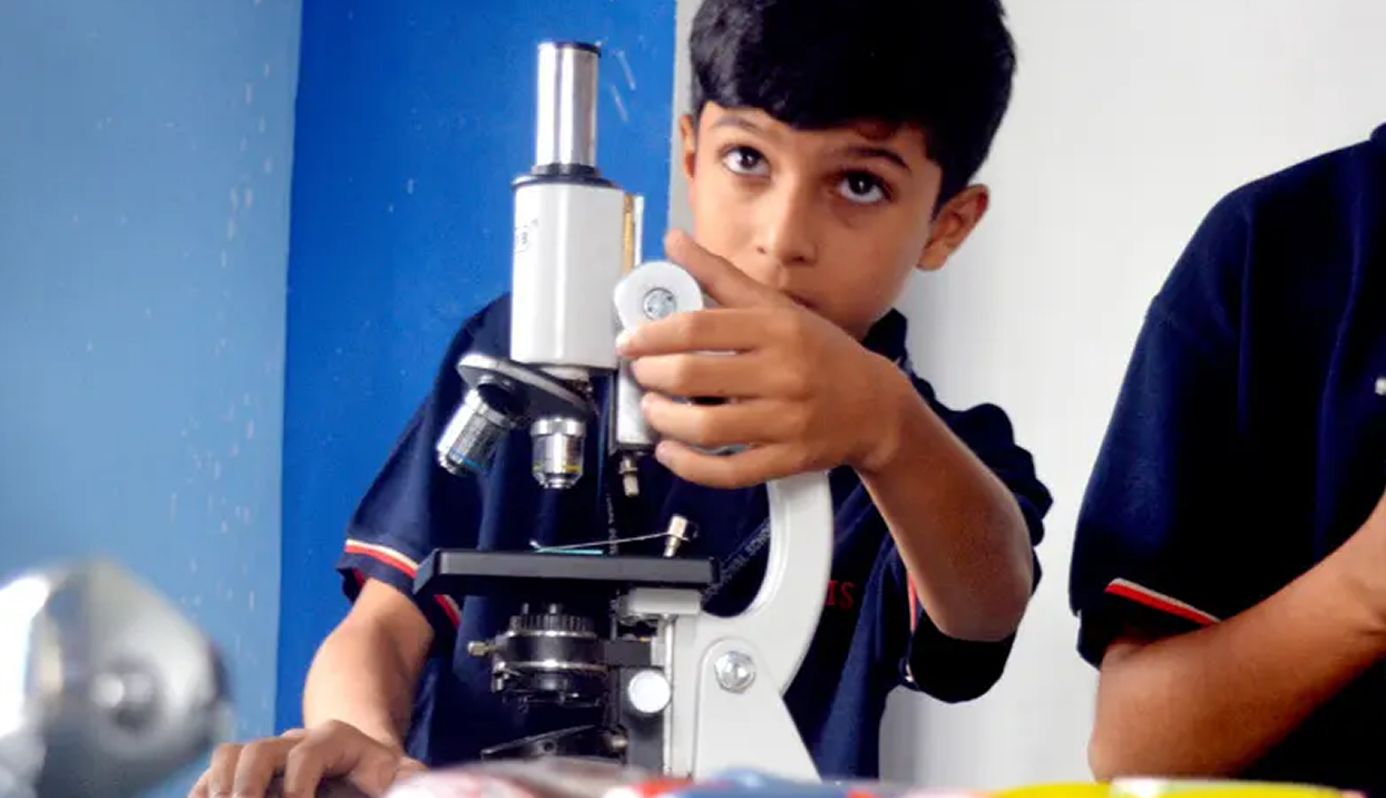 Student at microscope